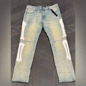 AMIRI Light Blue Jeans with White Skeleton Design